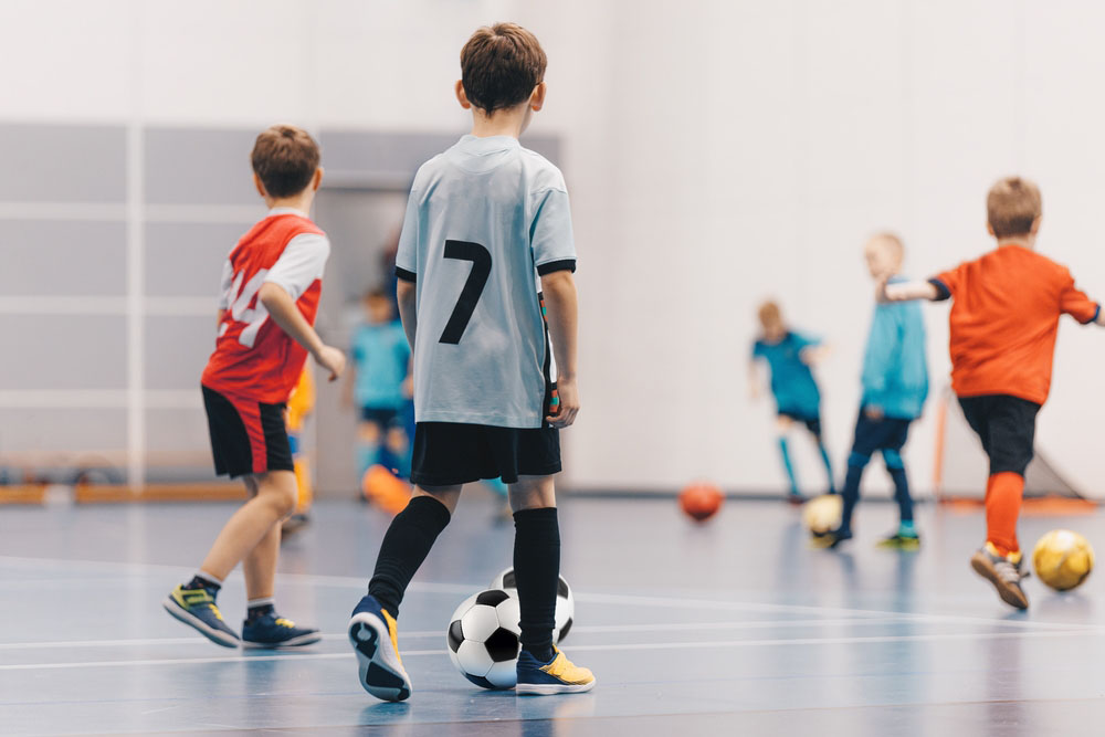 Futsal Boys in Training Game. Kids Play Indoor Soccer Practice Match. School Children Have Fun in Physical Education Class